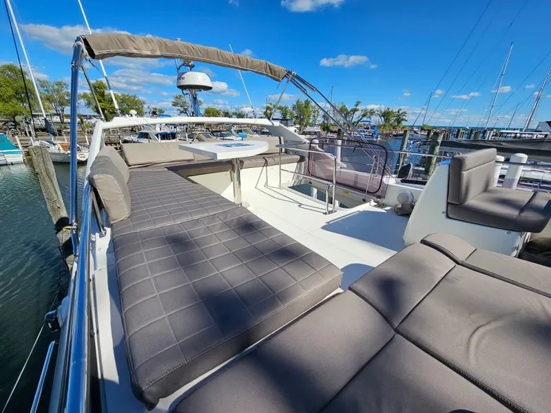 Slide: The Image of Luxurious deck of Prestige 460 yacht, 2018 model, docked at marina. - 10