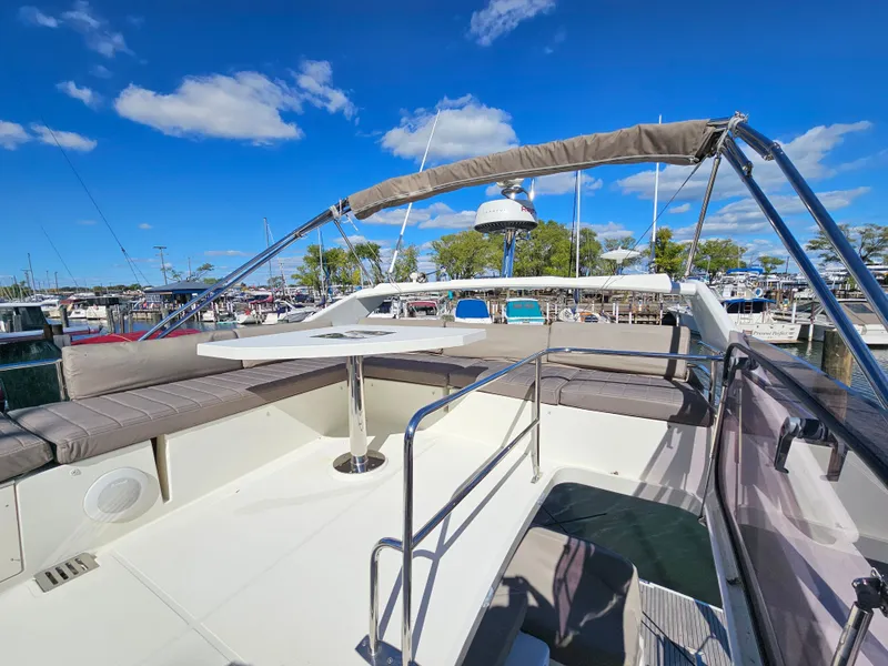 Slide: The Image of Prestige 460 Yacht 2018 with spacious deck and seating area. - 11