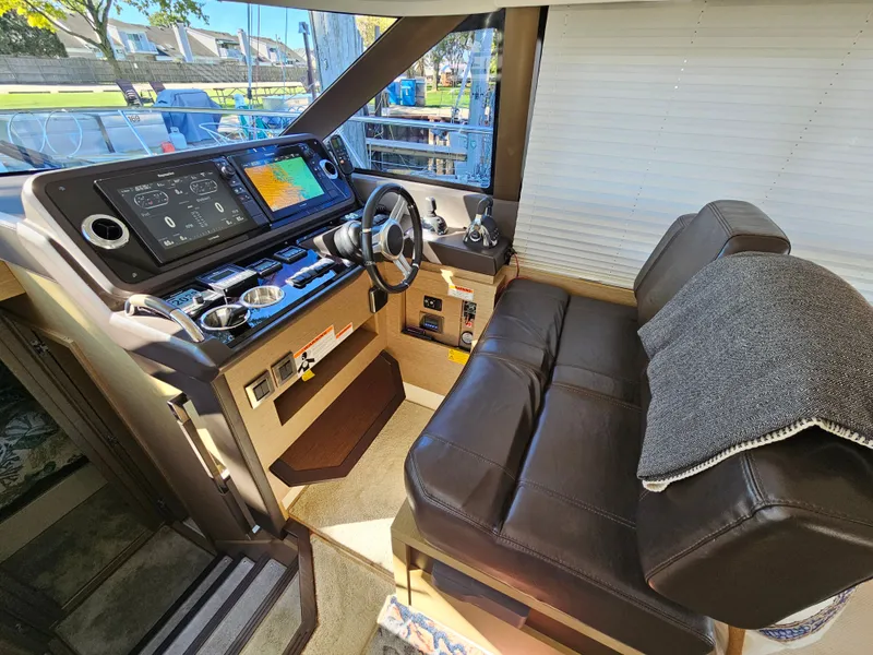 Slide: The Image of Interior of a 2018 Prestige 460 yacht with modern helm console. - 2
