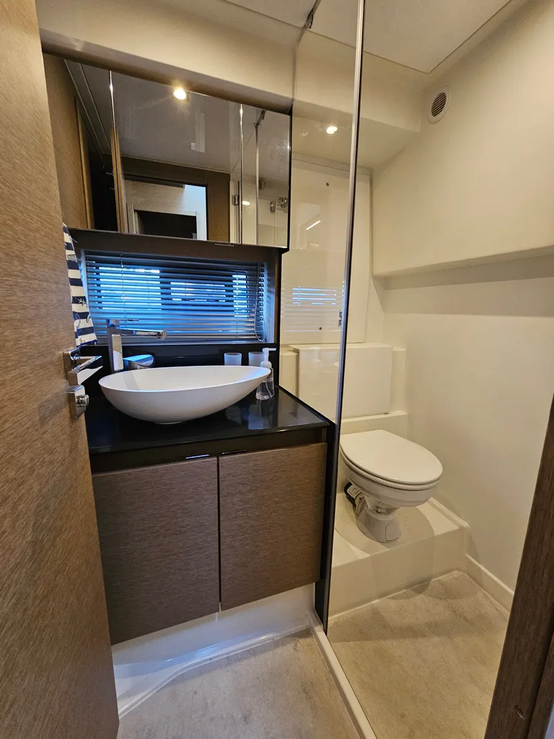 Slide: The Image of Luxurious bathroom on a 2018 Prestige 460 yacht. - 23