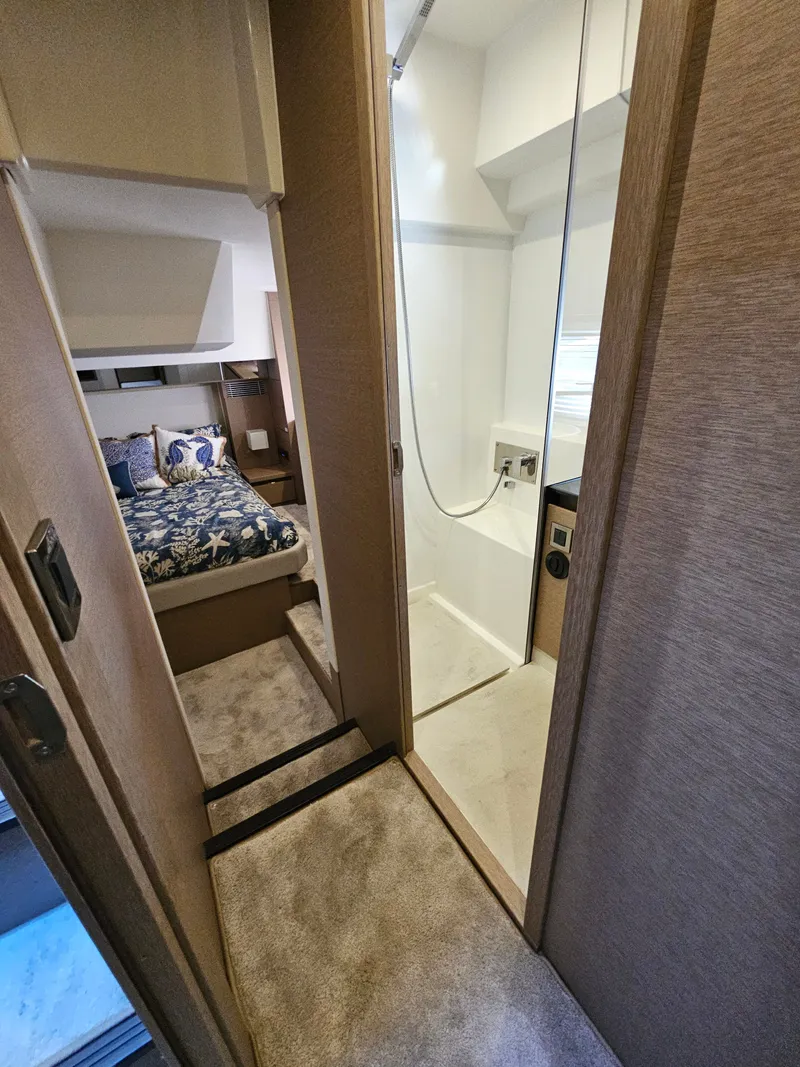 Slide: The Image of Interior of a 2018 Prestige 460 yacht with bedroom and bathroom. - 28