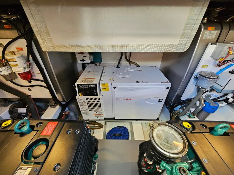 Slide: The Image of Engine room of a 2018 Prestige 460 with Cummins Onan generator. - 35