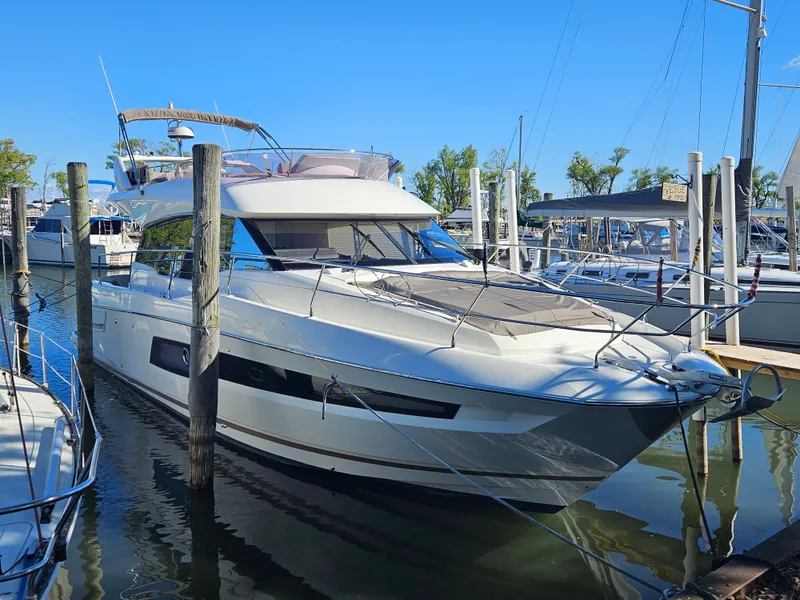 Slide: The Image of 2018 Prestige 460 yacht docked at marina. - 6