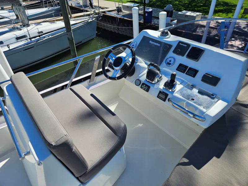 Slide: The Image of Helm of a 2018 Prestige 460 yacht docked in marina. - 9