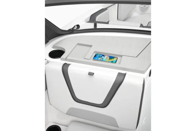 Slide: The Image of 2026 Yamaha Boats AR220 interior with phone holder and cup holder. - 10