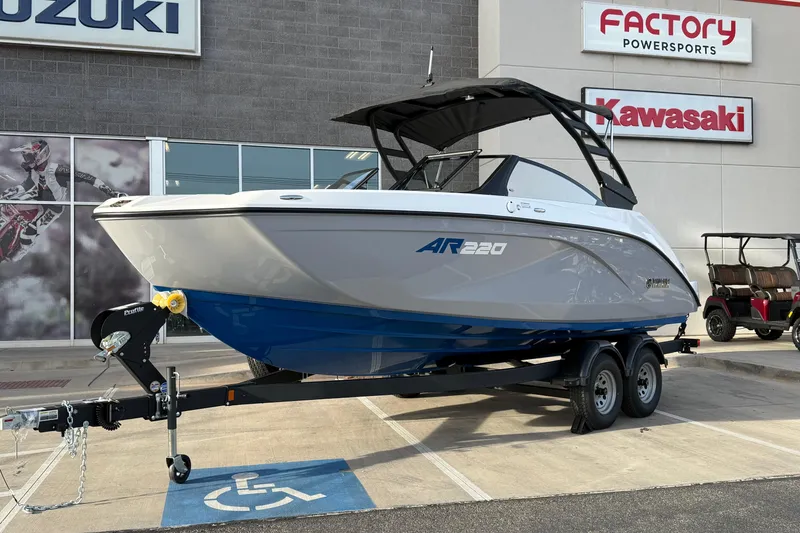 Slide: The Image of 2026 Yamaha Boats AR220 on trailer at dealership, featuring sleek design and modern features. - 14