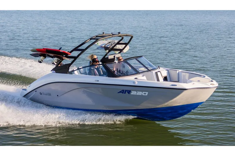 Slide: The Image of 2026 Yamaha Boats AR220 cruising on water, featuring sleek design and wakeboard tower. - 15