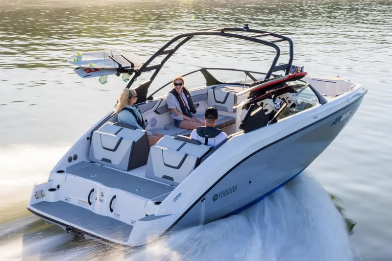 Slide: The Image of 2026 Yamaha Boats AR220 cruising on water with passengers enjoying the ride. - 3