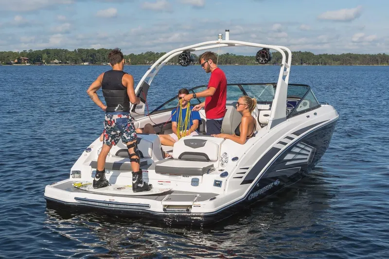 Slide: The Image of 2018 Chaparral Vortex 243 VRX boat with people enjoying water activities. - 2