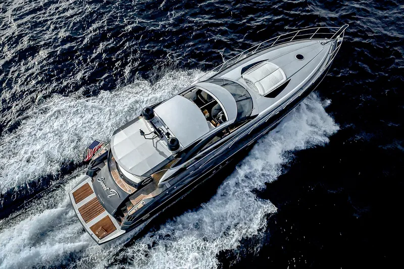Slide: The Image of Aerial view of 2021 Sunseeker Predator 68 yacht cruising on the ocean. - 31