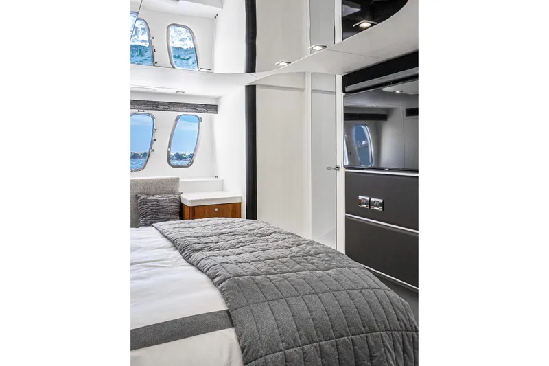 Slide: The Image of Luxurious interior of 2021 Sunseeker Predator 68 yacht bedroom with modern design. - 55