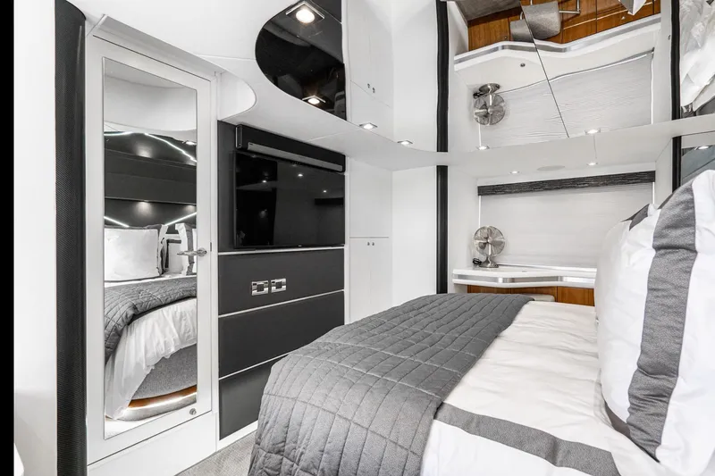 Slide: The Image of Luxurious Sunseeker Predator 68 yacht bedroom interior, 2021 model, featuring modern design and elegant decor. - 68