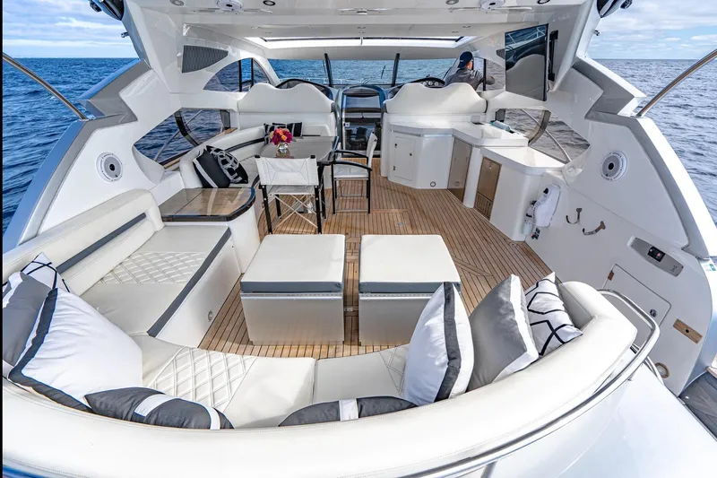 Slide: The Image of Luxurious 2021 Sunseeker Predator 68 yacht interior with elegant seating and ocean view. - 46