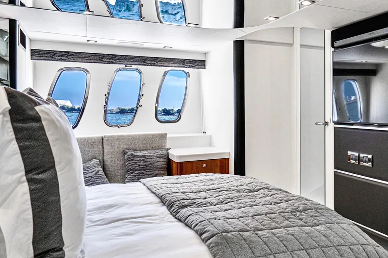 Slide: The Image of Luxurious bedroom interior of 2021 Sunseeker Predator 68 yacht with ocean view windows. - 56