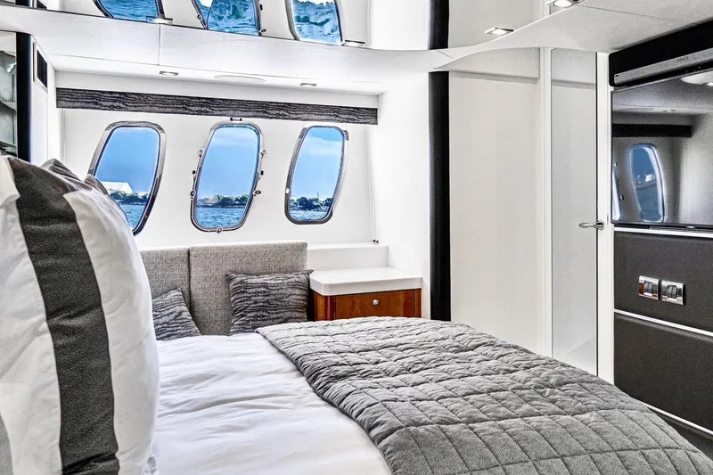 Slide: The Image of Luxurious bedroom interior of 2021 Sunseeker Predator 68 yacht with ocean view windows. - 59