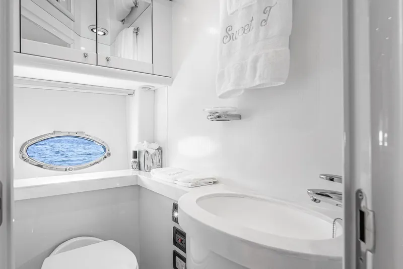 Slide: The Image of Luxurious bathroom in 2021 Sunseeker Predator 68 yacht with ocean view porthole. - 70