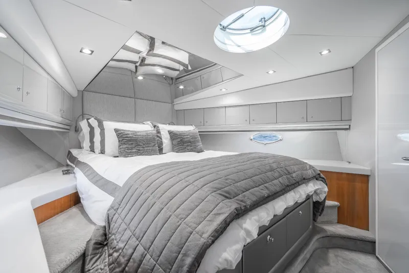 Slide: The Image of Luxurious bedroom interior of 2021 Sunseeker Predator 68 yacht with modern design and elegant bedding. - 73
