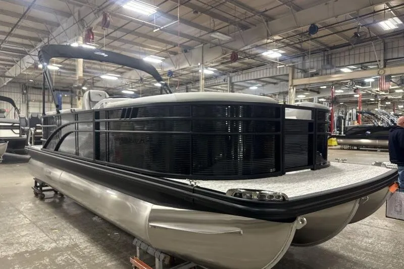 The Image of 2026 Bennington 22SXSR pontoon boat in a factory setting, showcasing sleek design. - 1