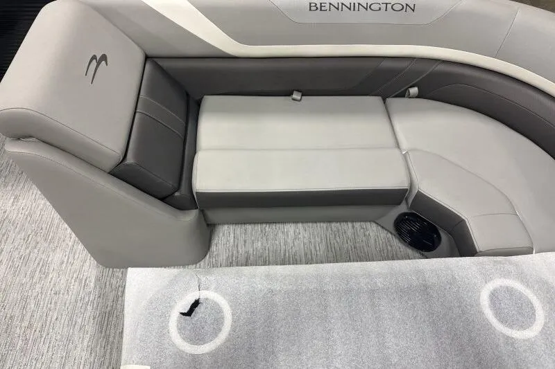 Slide: The Image of 2026 Bennington 22SXSR boat interior with gray seating and carpeted flooring. - 7
