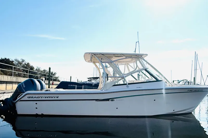 The Image of 2014 Grady-White Freedom 275 boat docked in sunny marina. - 0