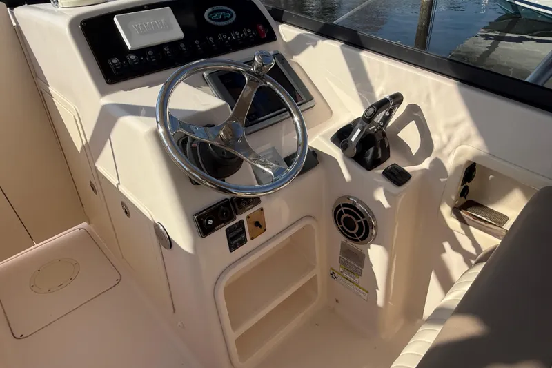 Slide: The Image of Garmin GPSmap 7212 displaying navigation data on a Grady-White Freedom 275 boat. - 10