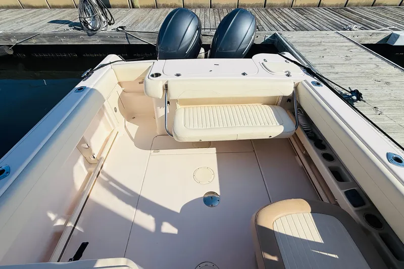 Slide: The Image of 2014 Grady-White Freedom 275 boat interior with seating and storage compartments. - 5