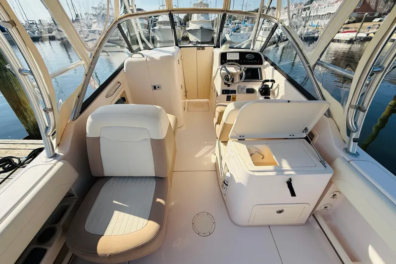 Slide: The Image of 2014 Grady-White Freedom 275 boat interior with open storage compartments. - 7