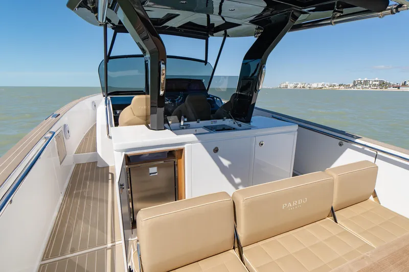Slide: The Image of 2025 Pardo Yachts P38R interior with beige seating and ocean view. - 14
