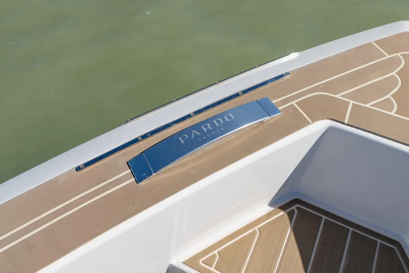 Slide: The Image of 2025 Pardo Yachts P38R deck detail with elegant wood finish and branding. - 36
