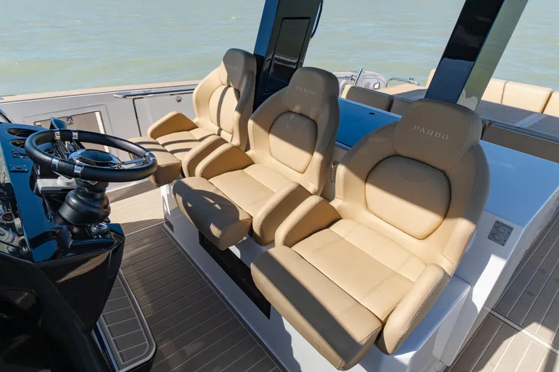 Slide: The Image of 2025 Pardo Yachts P38R interior with sleek design and modern controls on open water. - 17