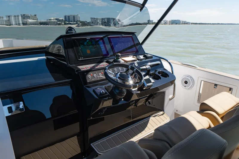Slide: The Image of 2025 Pardo Yachts P38R helm with modern navigation systems and luxurious seating. - 19