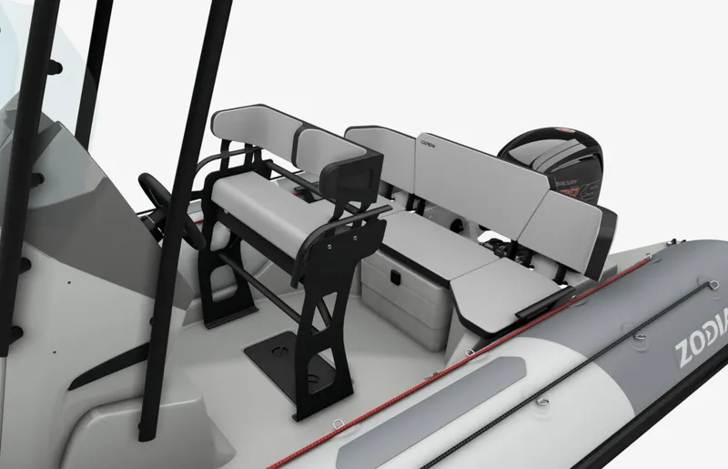 Slide: The Image of 2024 Zodiac Open 5.5 boat interior with seating and storage compartments. - 2