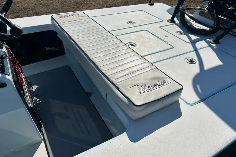 Slide: The Image of 2014 Maverick 17 HPX-S boat interior with cushioned seating and steering console. - 10