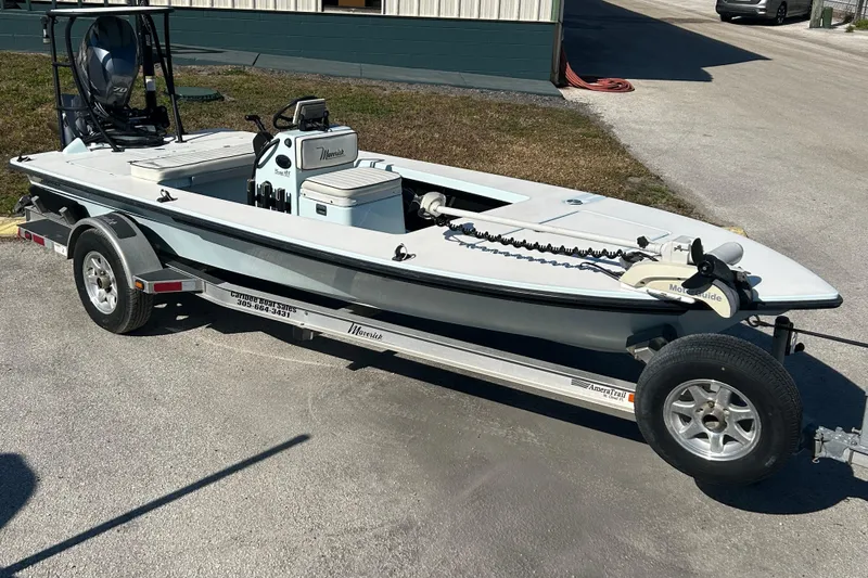 Slide: The Image of 2014 Maverick 17 HPX-S boat on trailer, parked outdoors in sunlight. - 12