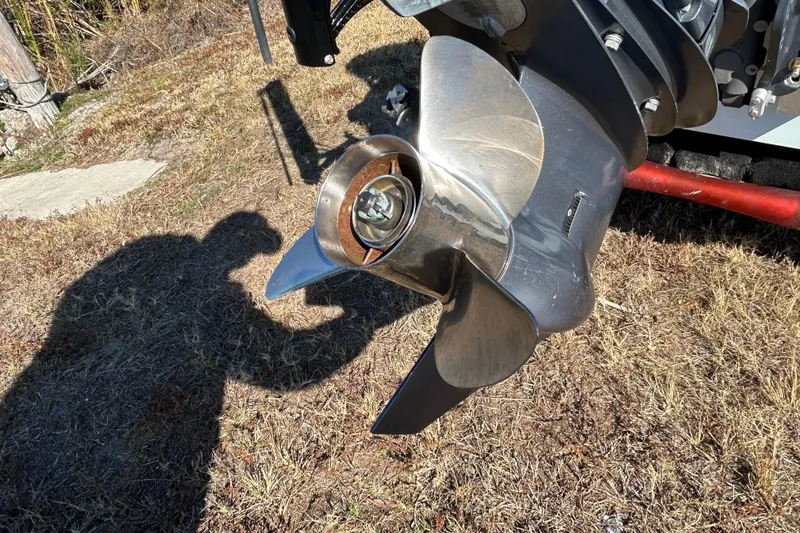 Slide: The Image of Propeller of 2014 Maverick 17 HPX-S boat on grassy ground, casting shadow. - 5