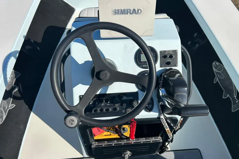 Slide: The Image of Steering console of 2014 Maverick 17 HPX-S boat with Simrad navigation system. - 9