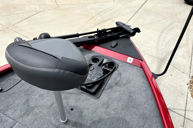 Slide: The Image of 2026 Tracker Savage 215 boat with seat and trolling motor on deck. - 16