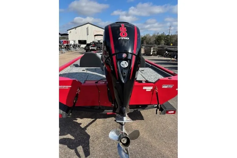 Slide: The Image of 2026 Tracker Pro Team 195 boat with a 150 HP engine, red and black design. - 5