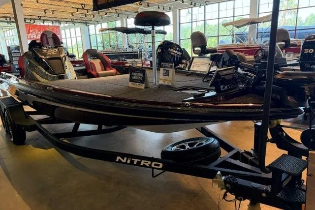 Slide: The Image of 2026 Nitro Z20 XL Pro boat displayed in a showroom, highlighting sleek design and advanced features. - 2