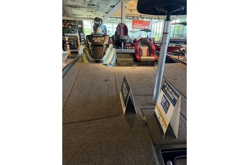 Slide: The Image of 2026 Nitro Z20 XL Pro boat displayed in showroom with promotional signs. - 5