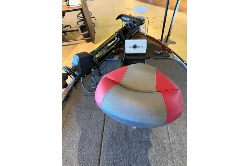 Slide: The Image of 2026 Nitro Z20 XL Pro boat interior with red and gray seat, Garmin equipment visible. - 7