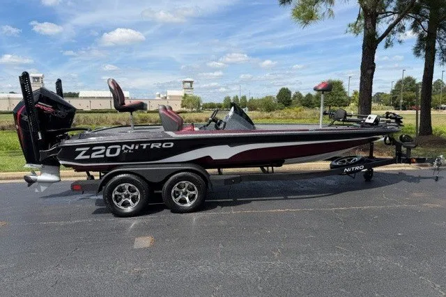 The Image of 2026 Nitro Z20 XL Pro bass boat on trailer, parked outdoors. - 0