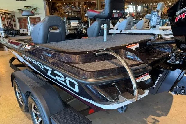 Slide: The Image of 2026 Nitro Z20 XL Pro boat displayed indoors, showcasing sleek design and seating. - 3