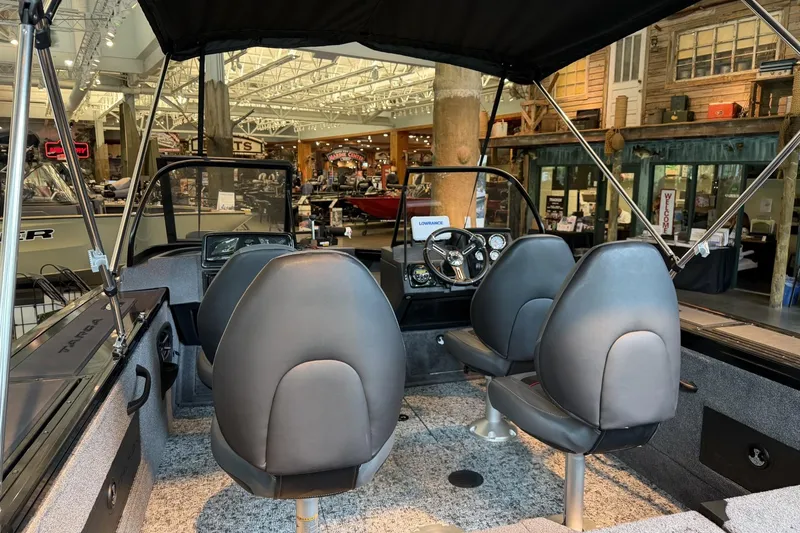 Slide: The Image of Interior of 2026 Tracker Targa V-18 Combo boat with seating and dashboard. - 4