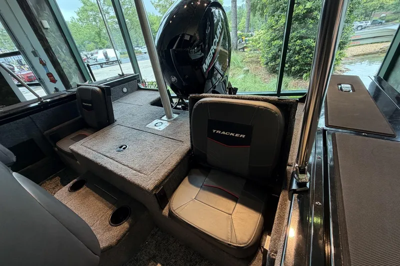 Slide: The Image of Interior of 2026 Tracker Targa V-18 Combo boat with seating and Mercury engine. - 10