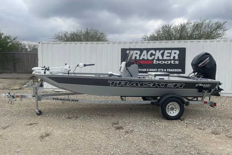 The Image of 2026 Tracker Bass Tracker Classic CC boat on trailer, displayed outdoors. - 0