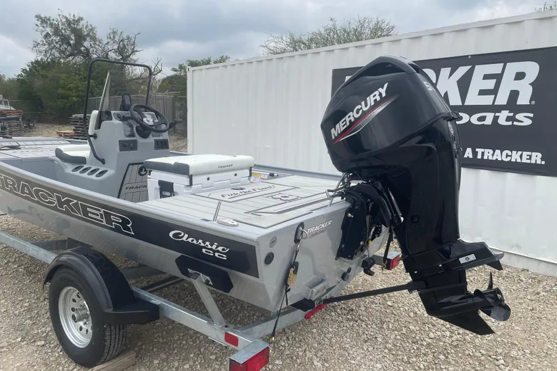 Slide: The Image of 2026 Tracker Bass Tracker Classic CC boat with Mercury engine on trailer. - 2