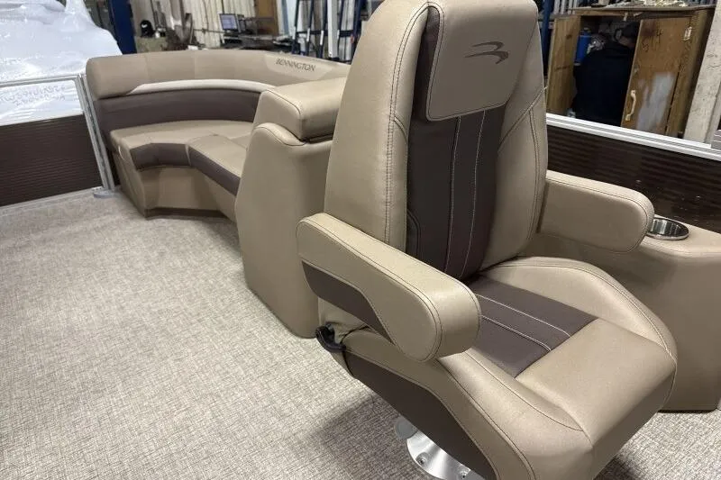 Slide: The Image of Luxurious seating on 2026 Bennington 22SXSR pontoon boat, featuring plush beige upholstery. - 10