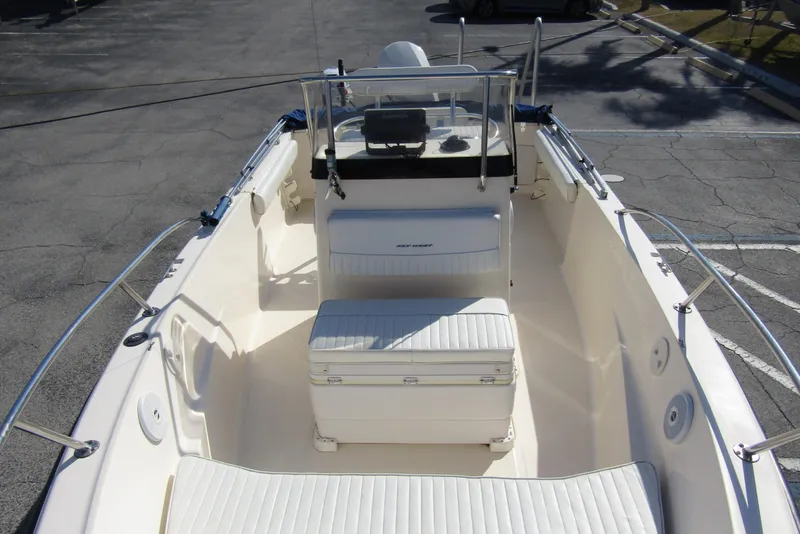 Slide: The Image of 2004 Key West Center Console boat interior with seating and steering console. - 11