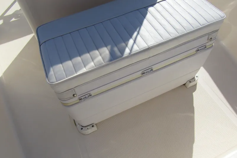 Slide: The Image of White cushioned seat on 2004 Key West Center Console boat. - 12